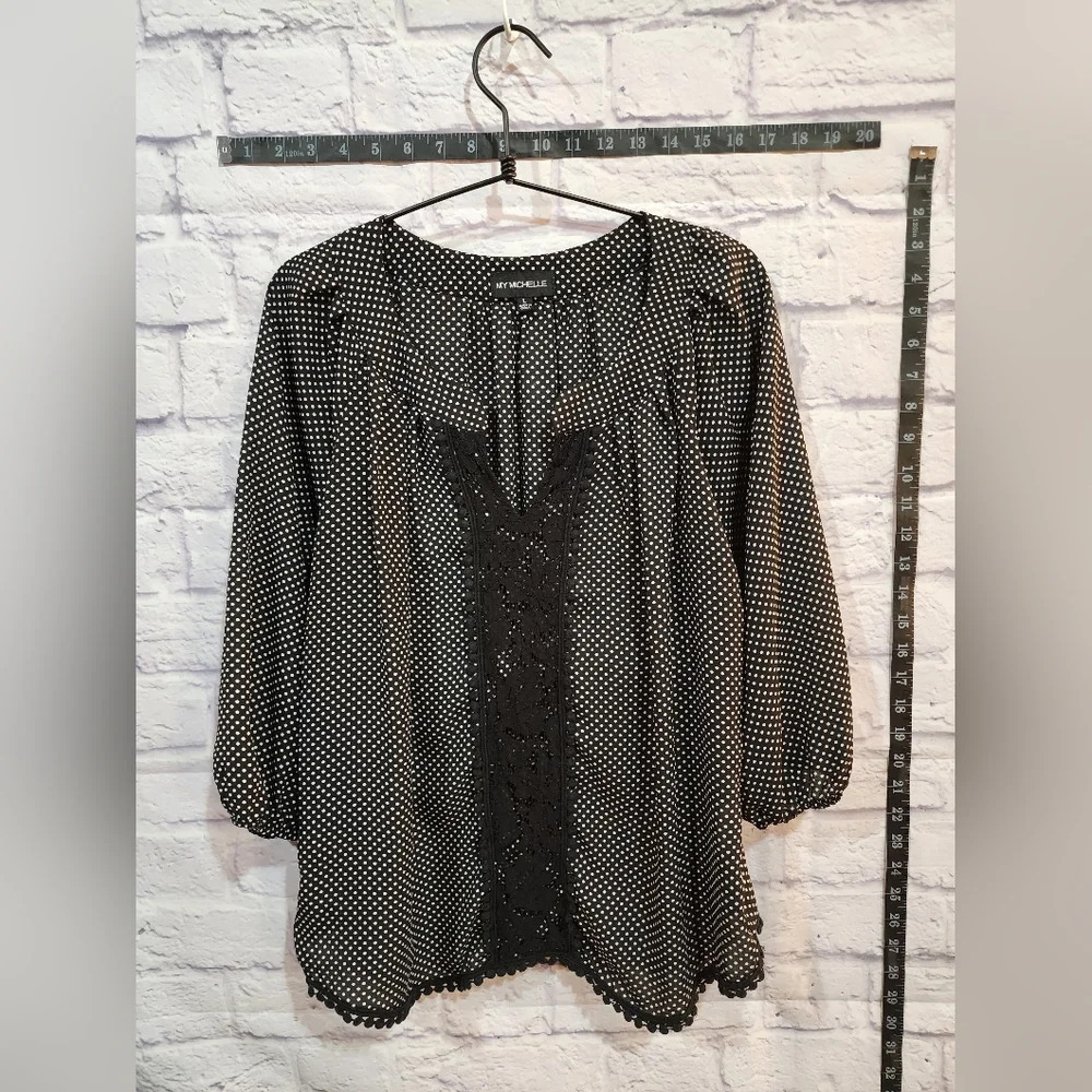 My Michelle blouse is black with small white polka dots. Size Large